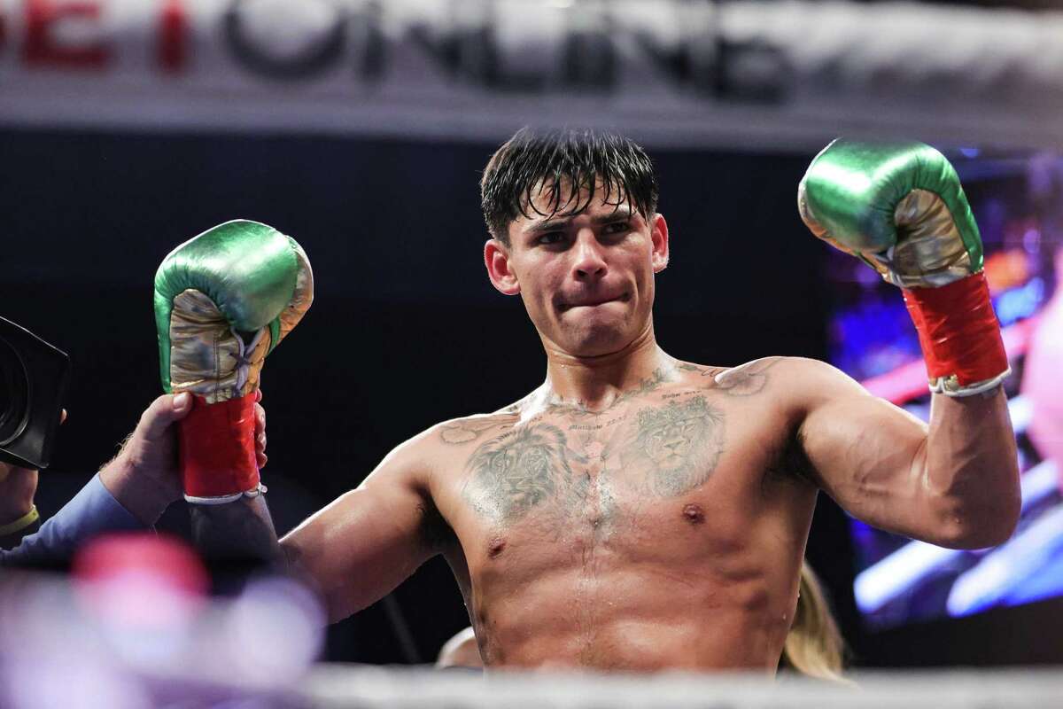 Ryan Garcia celebrates defeating Emmanuel Tagoe in their lightweight bout at the Alamodome on April 9, 2022 in San Antonio.