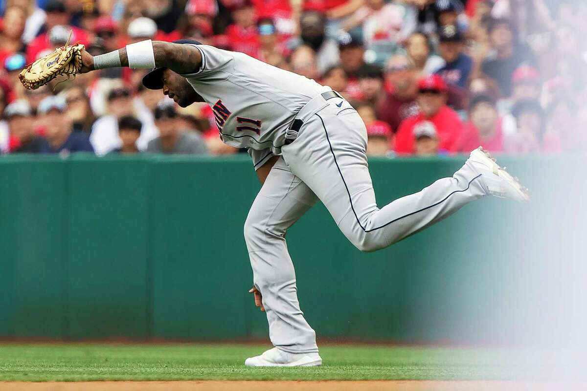 Houston Astros first baseman Niko Goodrum catches a fly ball hit by Los Angeles Angels' Mike Trout during the first inning of a baseball game in Anaheim, Calif., Sunday, April 10, 2022. (AP Photo/Alex Gallardo)