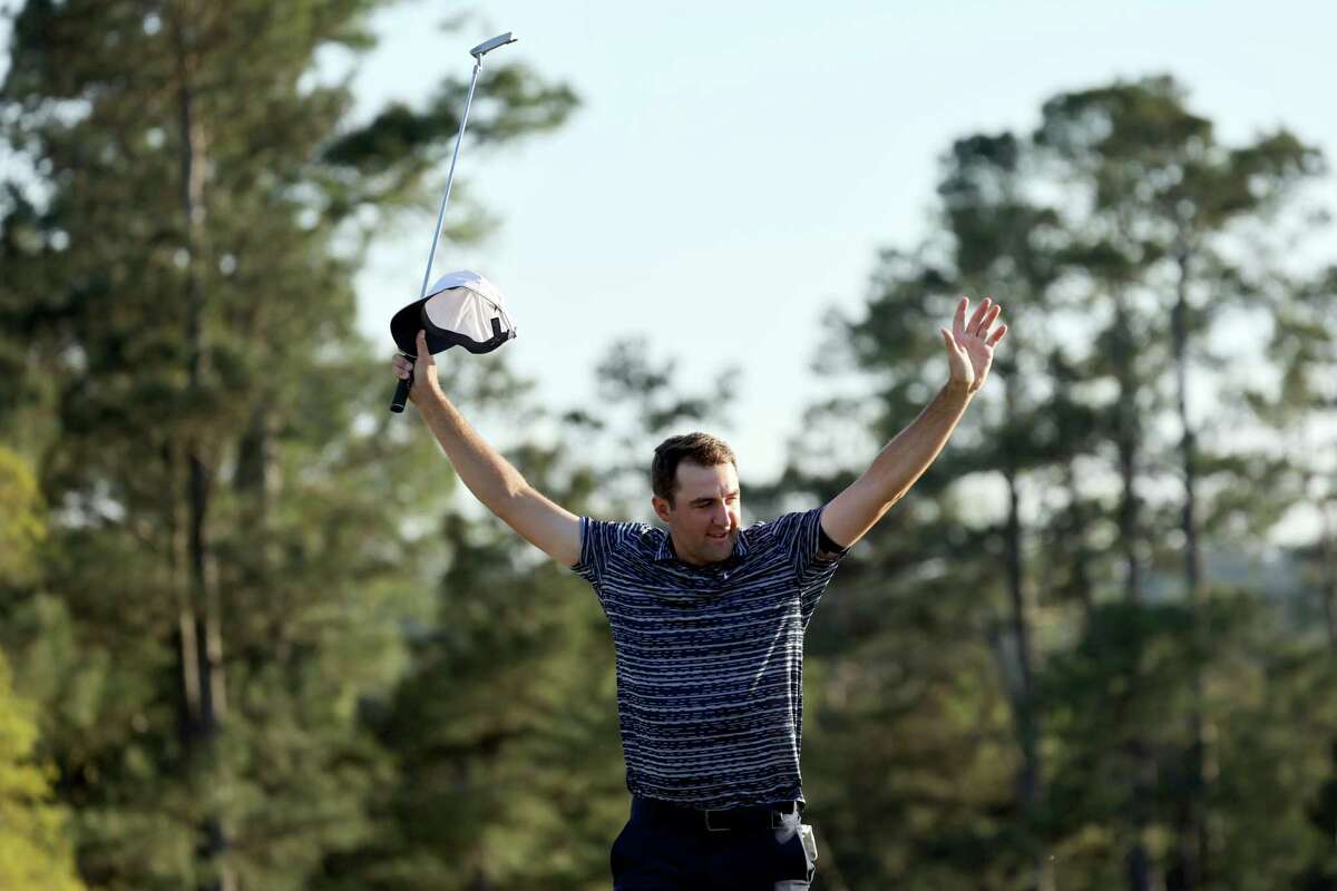 AUGUSTA, GEORGIA - APRIL 10: Scottie Scheffler celebrates on the 18th green after winning the Masters at Augusta National Golf Club on April 10, 2022 in Augusta, Georgia. (Photo by Gregory Shamus/Getty Images)