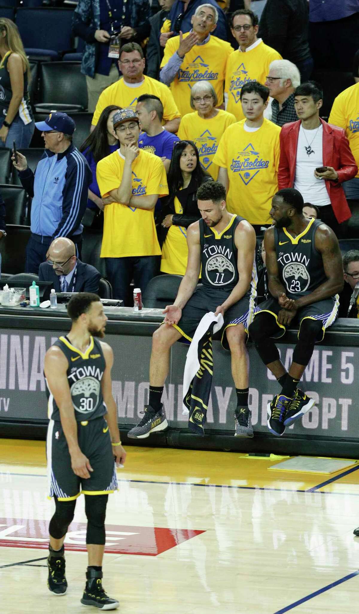 Golden State Warriors’ Stephen Curry, Klay Thompson, and Draymond Green are seen late in the fourth quarter during game 4 of the NBA Finals between the Golden State Warriors and the Toronto Raptors at Oracle Arena on Friday, June 7, 2019 in Oakland, Calif.