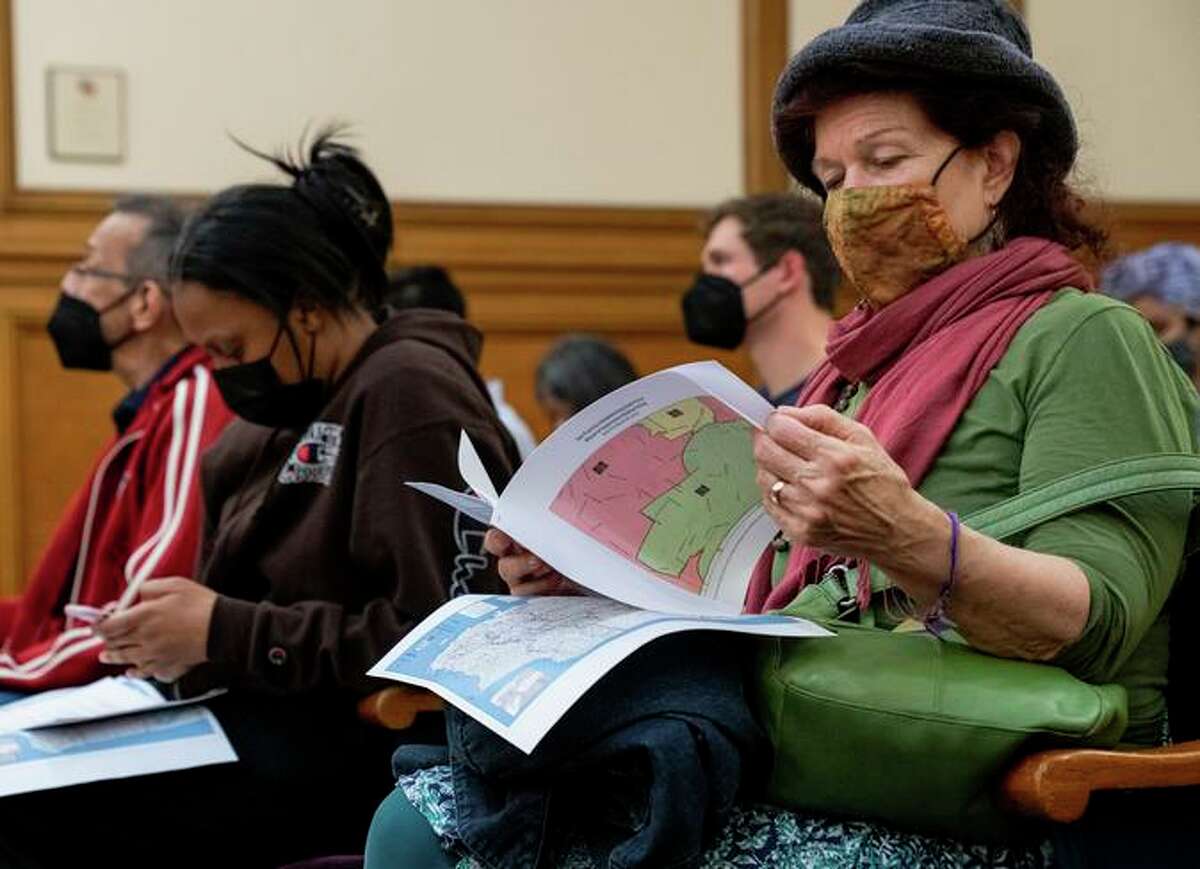 Community members wait to speak to the task force redrawing S.F.’s supervisorial districts.