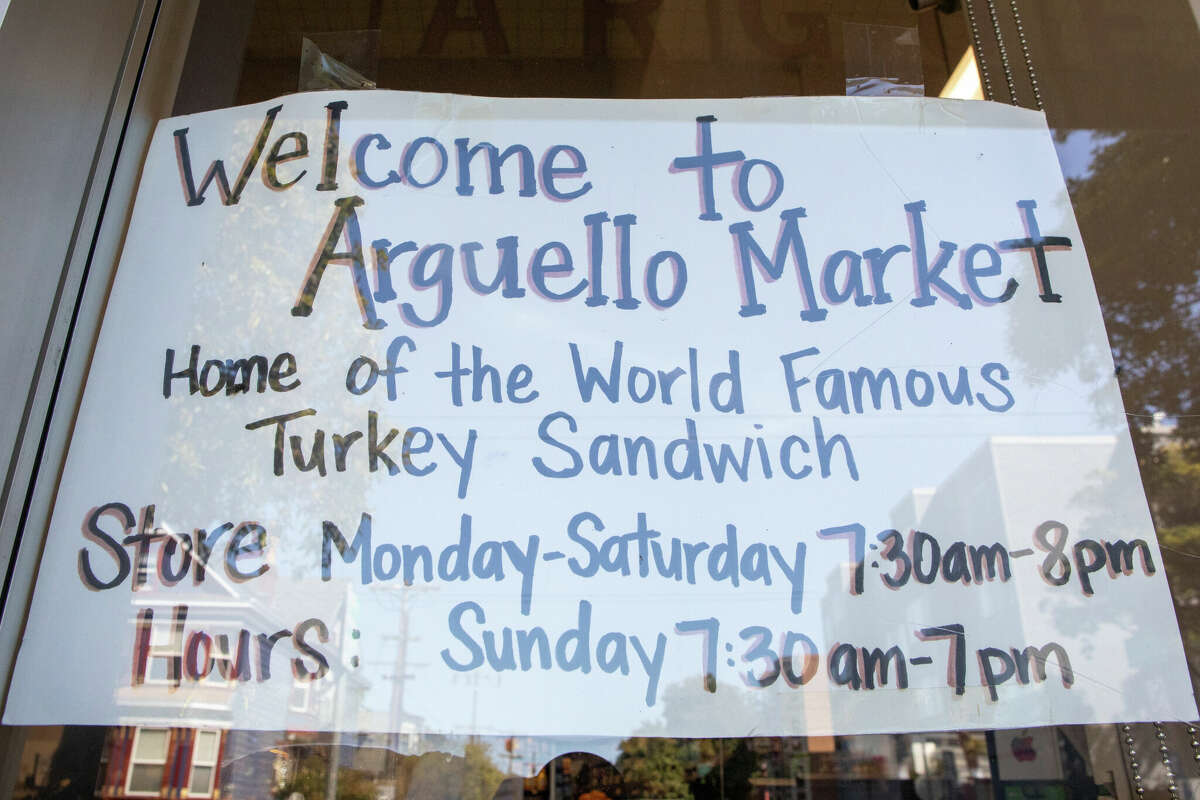 A sign of the window at Arguello Market in San Francisco, Calif. on Apr. 10, 2022. The market is the self-described home of the 'World Famous Turkey Sandwich.'at Arguello Market in San Francisco, Calif. on Apr. 10, 2022. The market is the self-described home of the 'World Famous Turkey Sandwich.'