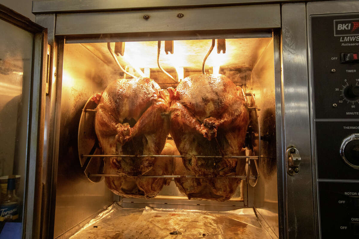 Turkeys roasting for sandwiches at Arguello Market. Customers have their choice between light or dark meat layered with their favorite toppings. 