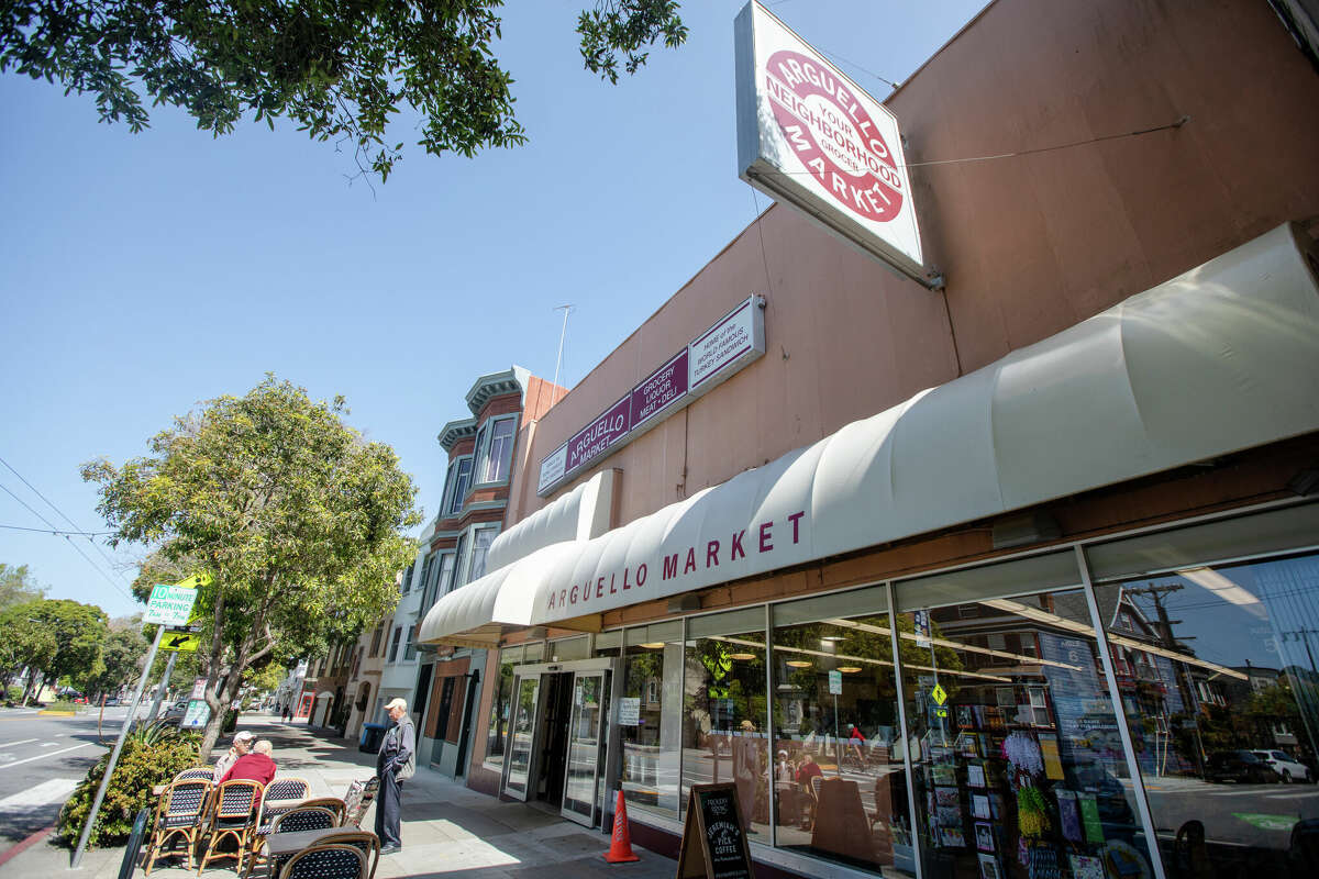 The sunny exterior of Arguello Market at 782 Arguello Blvd.