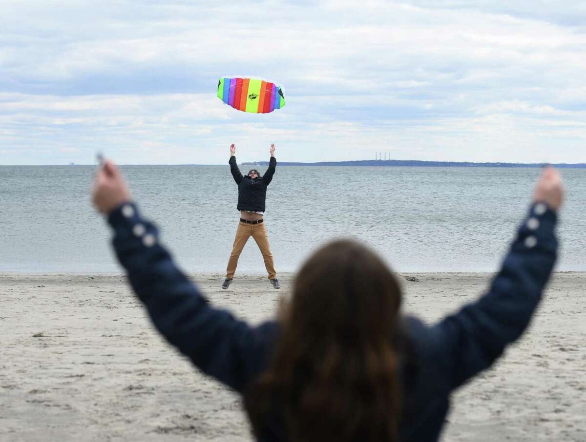 Greenwich’s Alex Dzerneyko tosses his kite in the air as his daughter, Sofia Dzerneyko, 9, controls the strings during the annual Kite Flying Festival at Greenwich Point Park in Old Greenwich, Conn. Sunday, April 10, 2022. Greenwich Recreation and Greenwich Arts Council partnered to host the festival, which atrracted hundreds of kite flyers on a perfectly windy day at the beach.