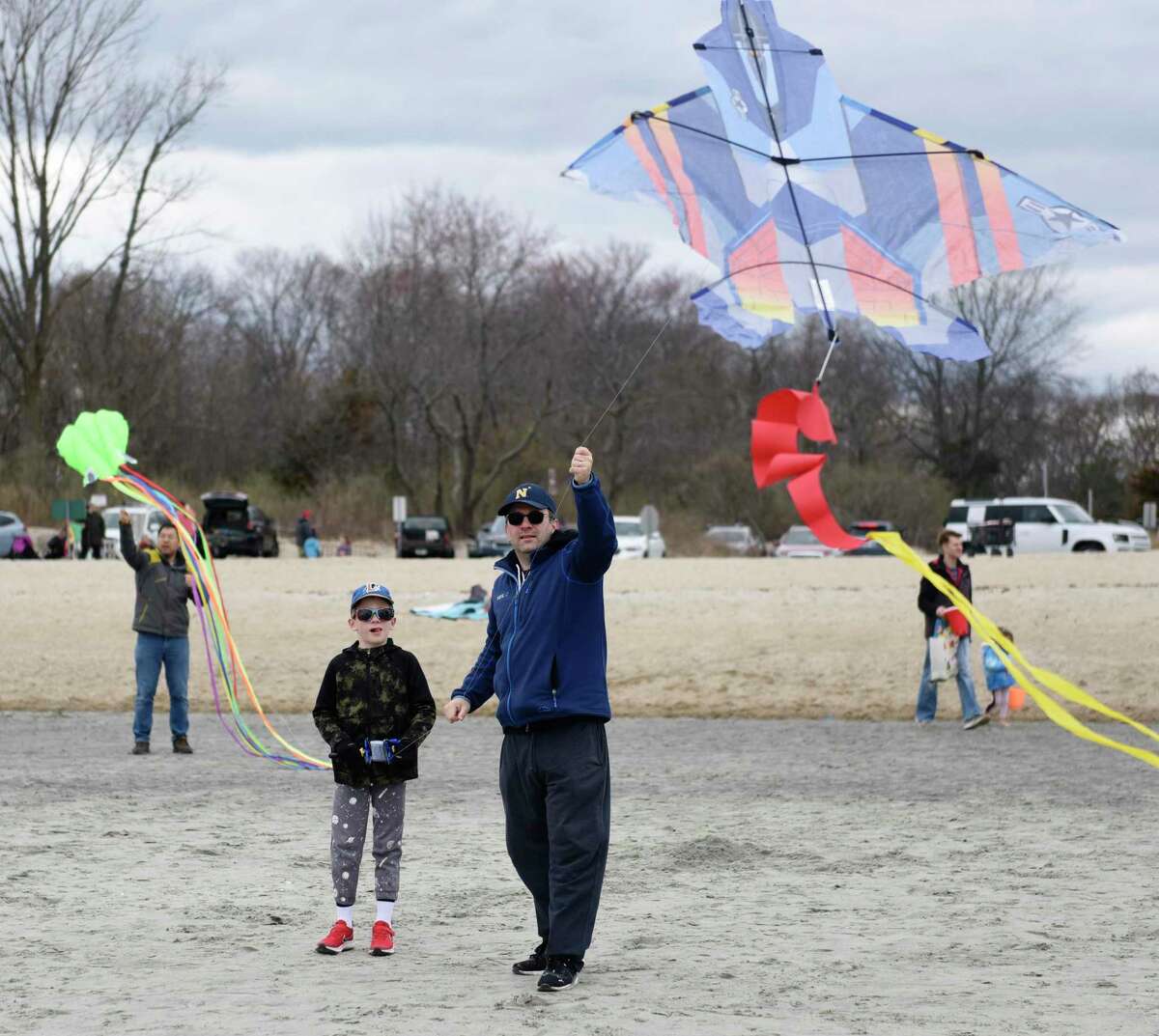 Oded Kafka of Greenwich and his son, Max Kafka, 7, fly a kite during the annual Kite Festival at Greenwich Point Park in Old Greenwich, Conn. on Sunday, April 10, 2022. Greenwich Recreation and Greenwich Arts Council teamed up to host the festival, which attracted hundreds of kites on a perfectly windy day at the beach.