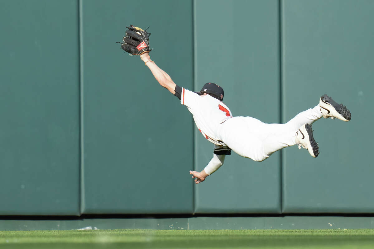 Edwardsville's Cade Hardy makes a diving catch in center field in the first inning against Jackson at Busch Stadium.