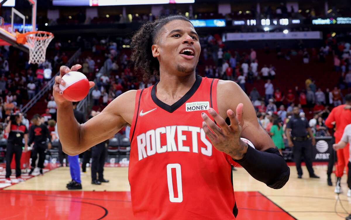 Jalen Green of the Houston Rockets tosses balls to fans following a game against the Atlanta Hawks at Toyota Center on April 10, 2022 in Houston.