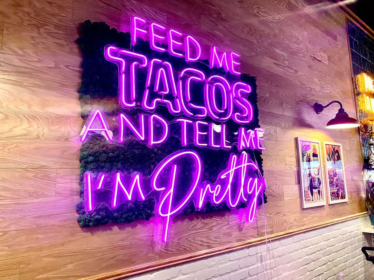 A neon sign greets guests at the new Stamford location of The Taco Project.