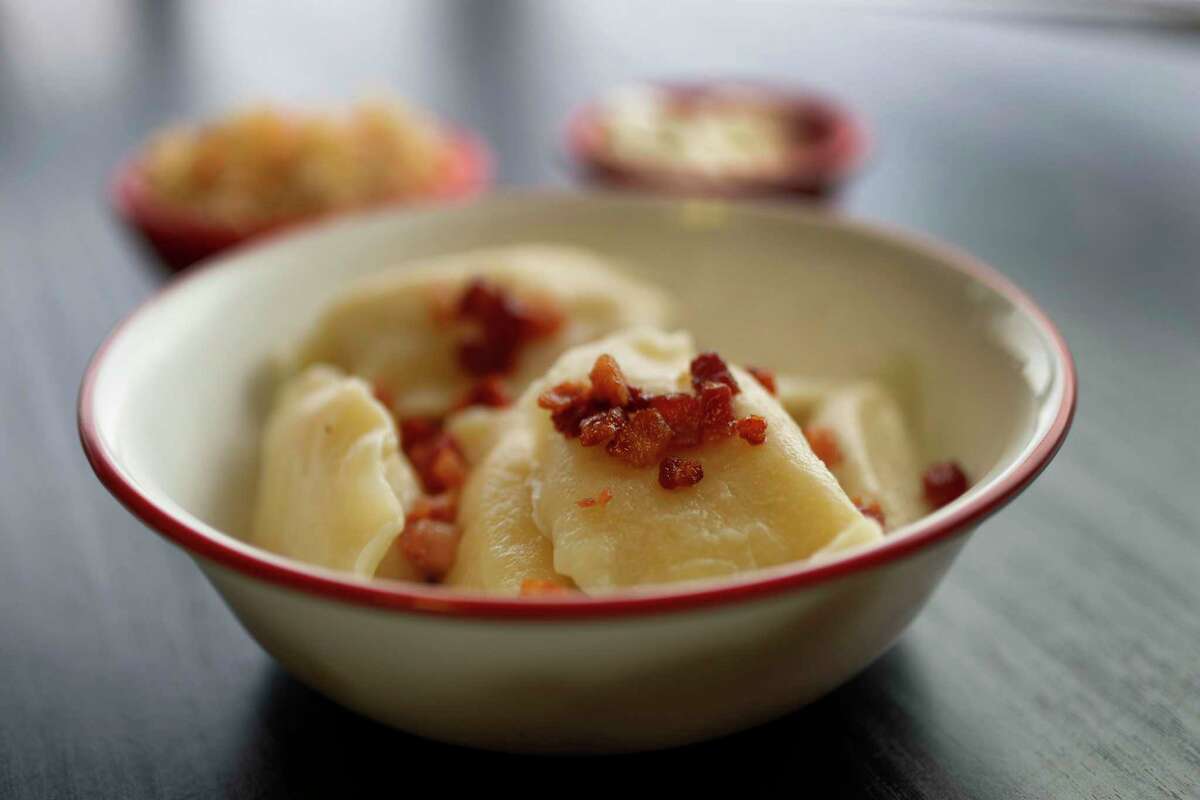 The potato and Polish farmer's cheese boiled pierogis with bacon bits at the Pierogi Queen in League City. The restaurant announced it will close May 20.