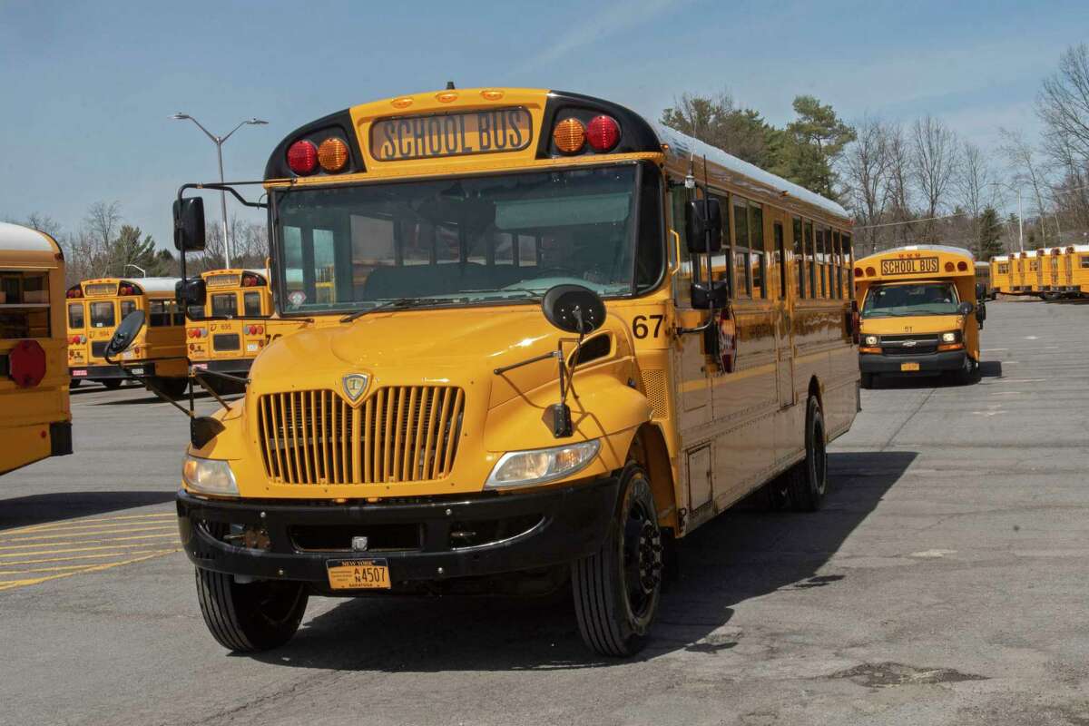 School buses are seen in the depot at Shenendehowa on Monday, April 11, 2022 in Albany, N.Y. NYS budget includes a mandate for all school buses to be electric by 2035.