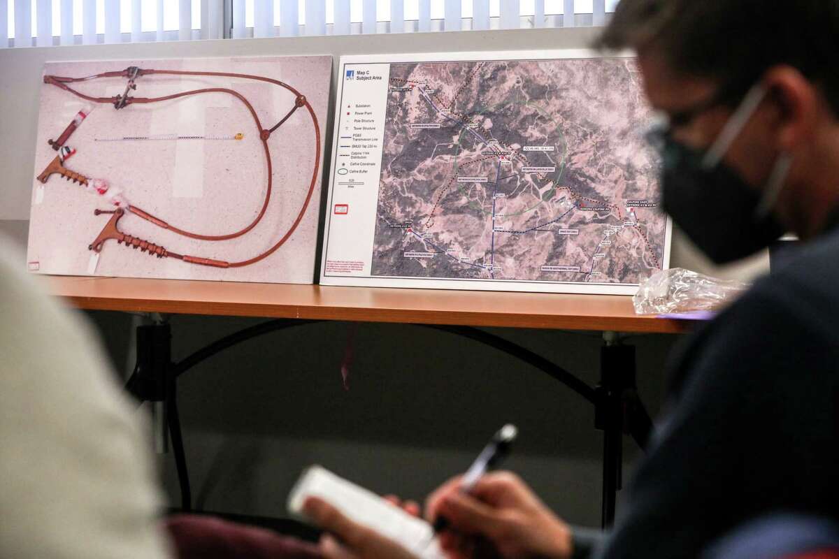 Photos show the snapped jumper cable that caused the 2019 Kincade fire and a map of the area at a press conference announcing the plea deal between PG&E and local Sonoma Superior Court prosecutors in Santa Rosa.
