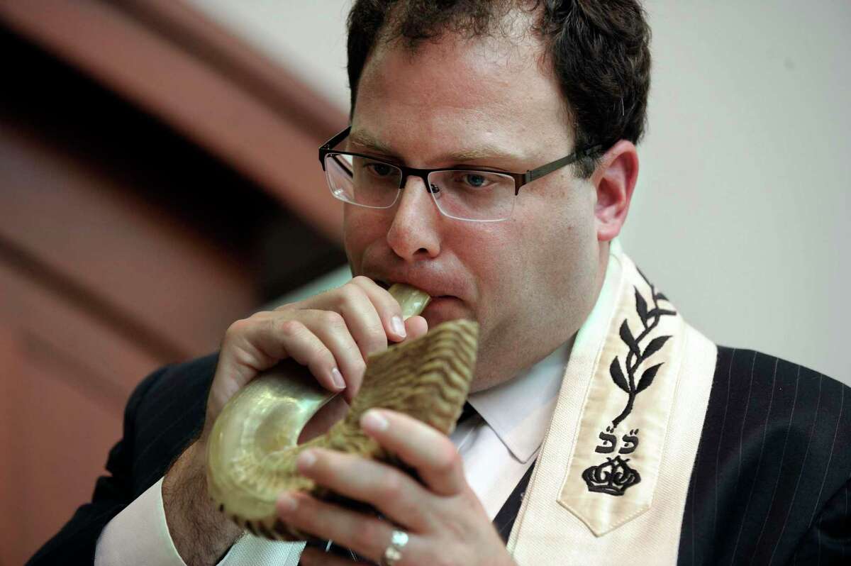 Rabbi David L. Reiner, of Temple Shearith Isreal, in Ridgefield, Conn., blows the Shofar at services at the the temple.