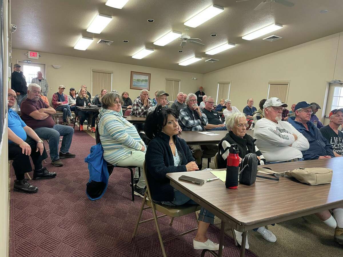 Property owners and local government officials gather for the Four Lakes Task Force board meeting on April 11, 2022 at Secord Township Hall. 