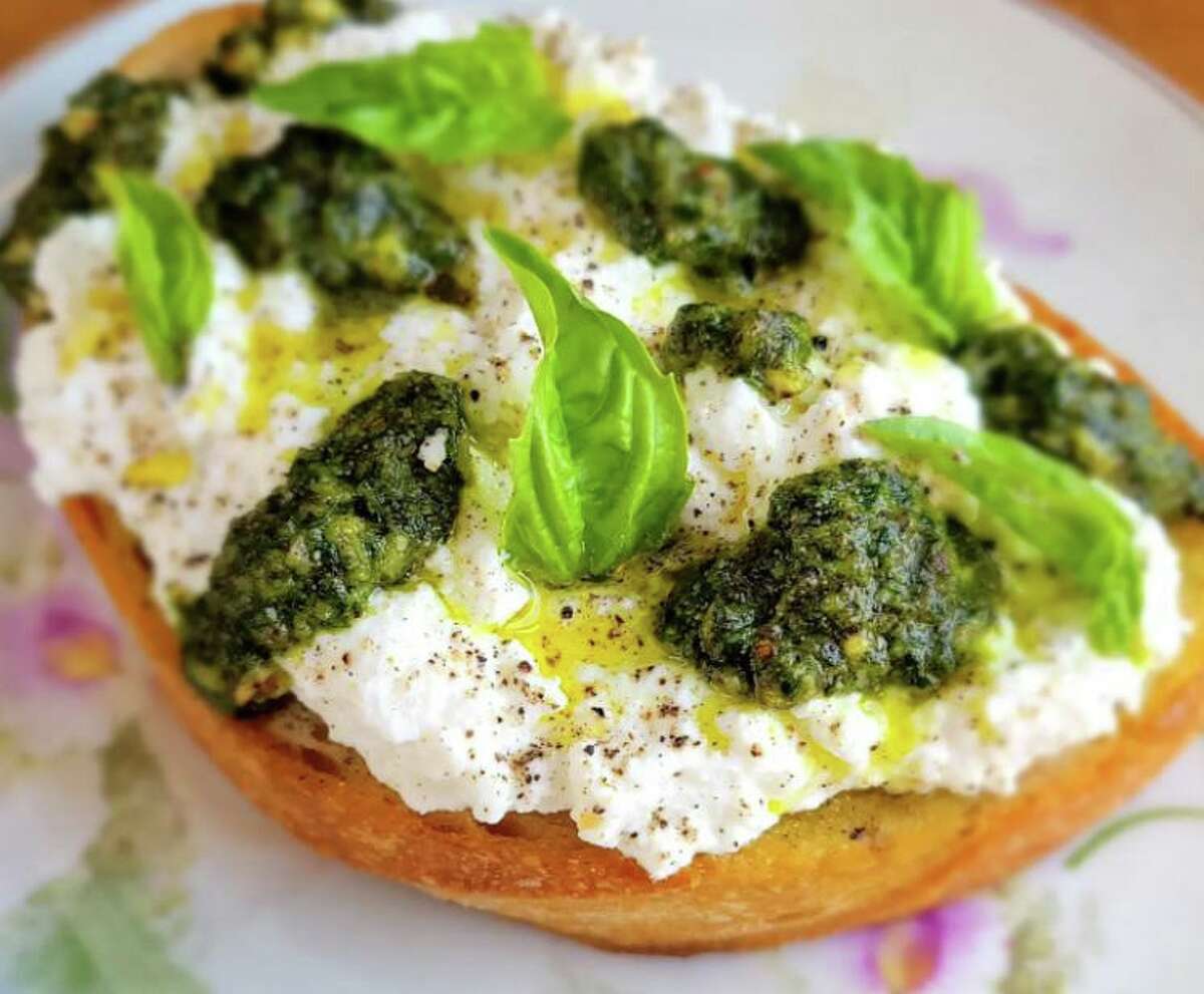 Sourgough bread with fresh cheese, pecan pesto and black pepper from Vintage Wine Bar & Specialty Foods