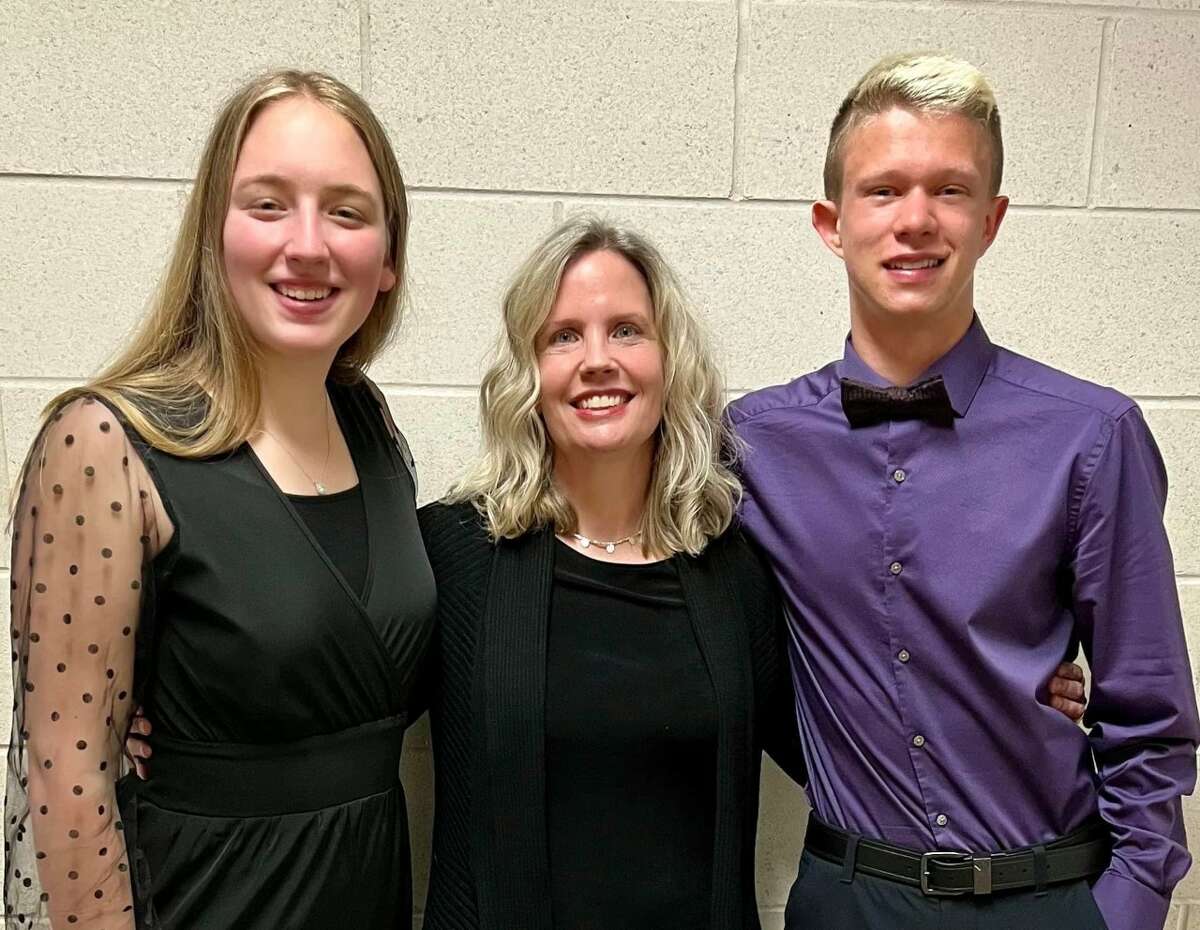 Manistee High School junior Emily Sullivan (left); Carrie Selbee, director of River City Music School; and Seth Thompson, MHS senior, pose for a photo at the Michigan School Band and Orchestra Association Concerto Competition at Central Michigan University in Mount Pleasant. Selbee accompanied the two Chippewas during their performances.