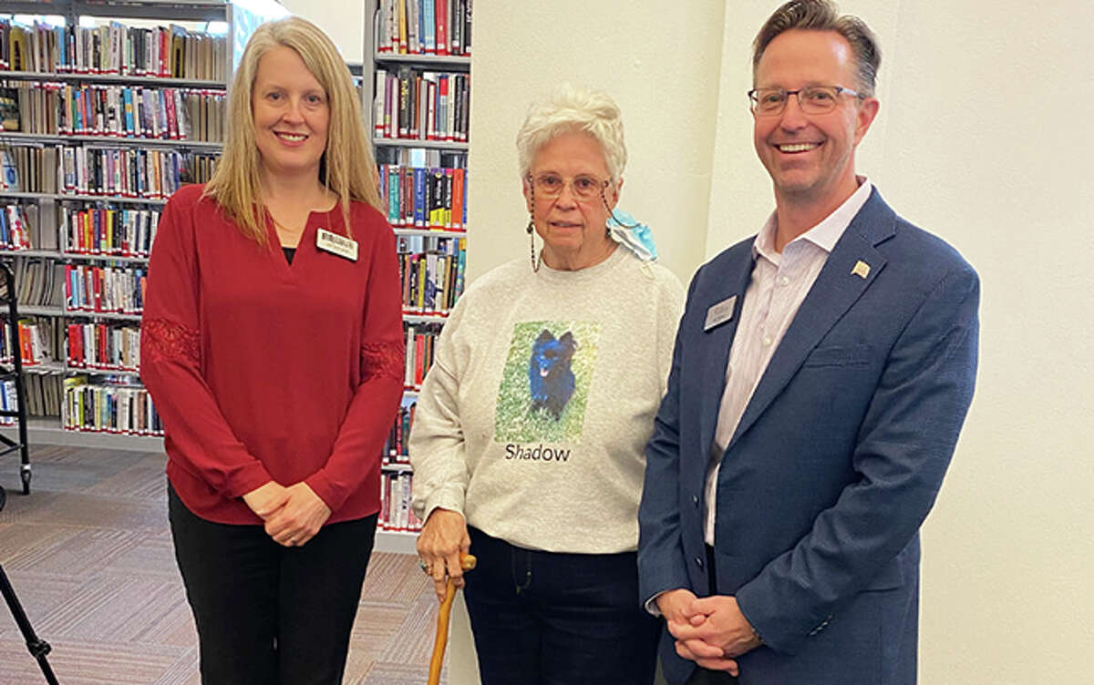 Sharon Whittaker, middle, with Edwardsville Public Library Director Jill Schardt and Edwardsville Mayor Art Risavy after a ribbon cutting at the library on March 25. Whittaker, who has been a member of the EPL board of trustees for 30 years and a board member of Edwardsville Library Friends since the mid-1980s, is resigning from both boards.