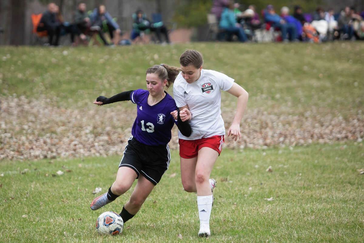 Calvary Baptist Academy's Ila Tomko dribbles down the field during a game against Tawas Monday, April 11, 2022 at Calvary Baptist Academy.