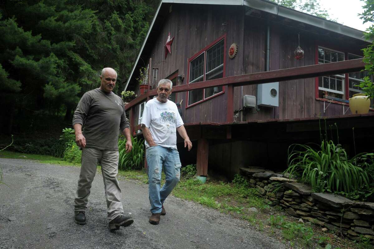 Chief Alan Russell, right, of the Schaghticoke Indian Tribe, walks with William Buchanan, senior advisor to the tribe, in 2019.