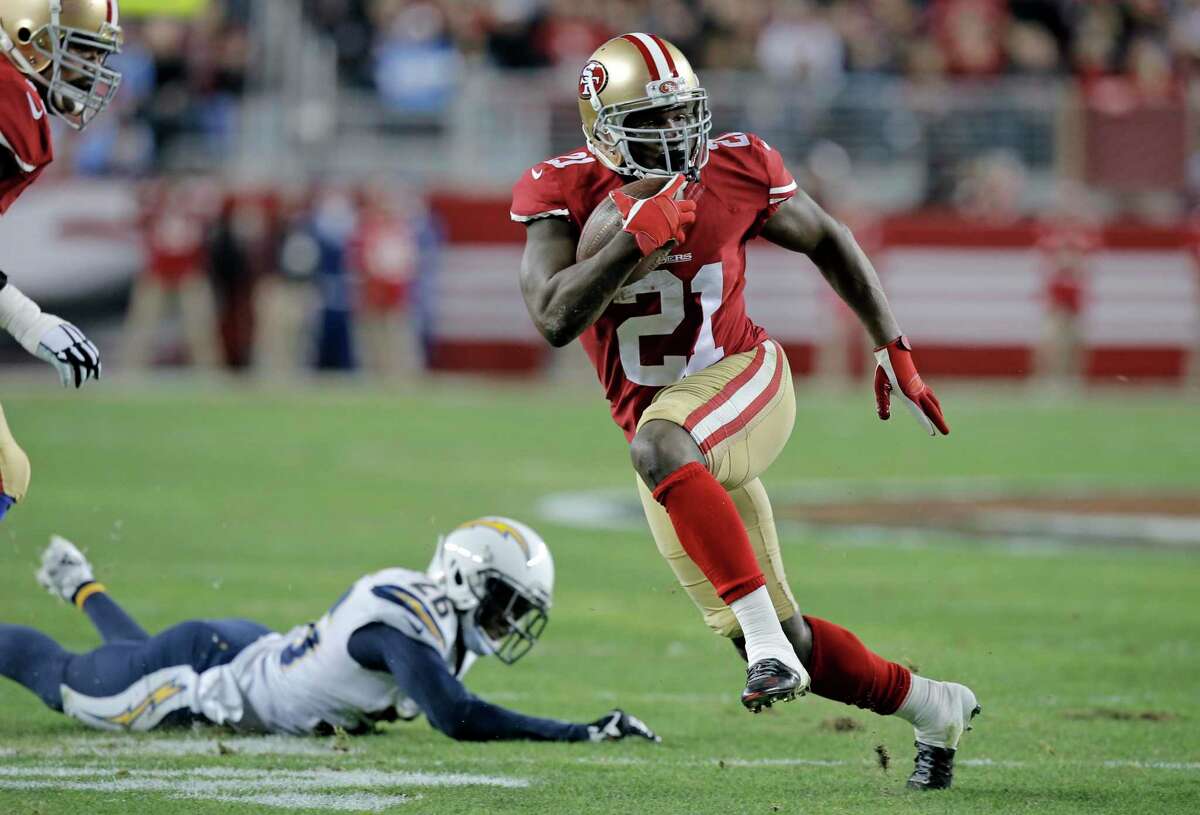 Frank Gore, shown here in a December 2014 game against the Chargers, is the leading rusher in 49ers history. Gore plans to sign a one-day contract with the team, retire as a player and join the front office in a player-evaluation role.