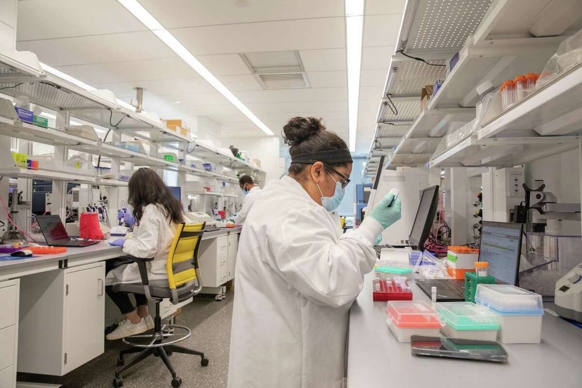 Researchers at work in lab space at Alexion's research and development facility at 100 College Street in New Haven.
