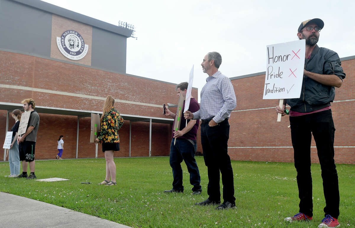 Protesters gathered outside Port Neches - Groves High School during Monday's school board meeting to call for the removal of the school's mascot, noting its offense to indigenous people. Photo made April 11, 2022. Kim Brent/The Enterprise