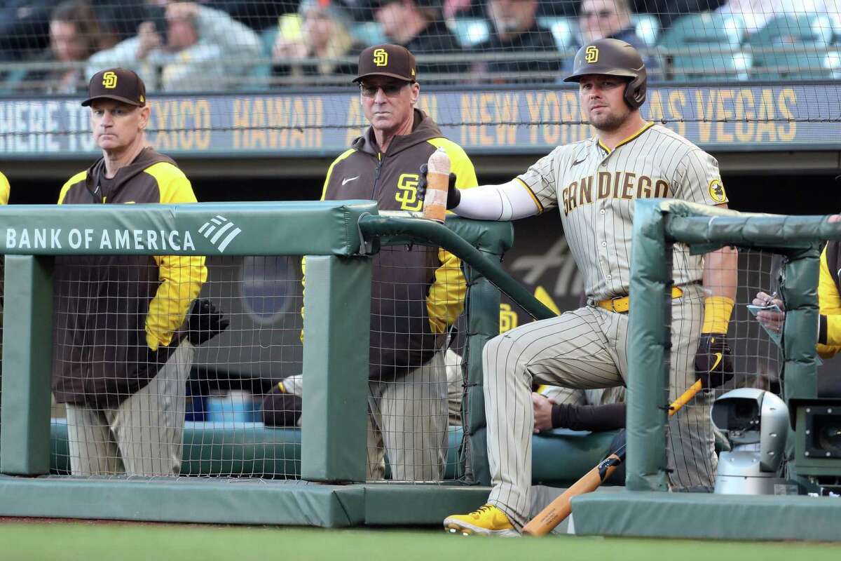 San Diego Padres’ manager Bob Melvin and Luke Voit watch 1st inning action while playing San Francisco Giants during MLB game at Oracle Park in San Francisco, Calif, on Monday, April 11, 2022.