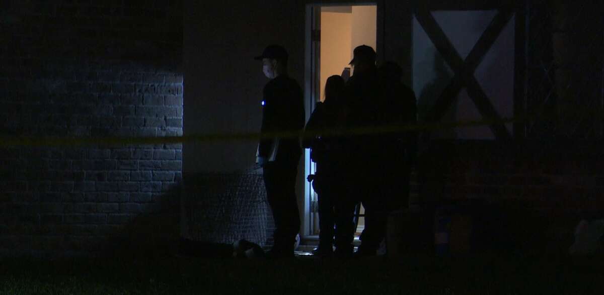 Houston police investigate the scene where a suspected home invader was fatally shot April 11, 2022, in the 12500 block of Cooperstown Drive.