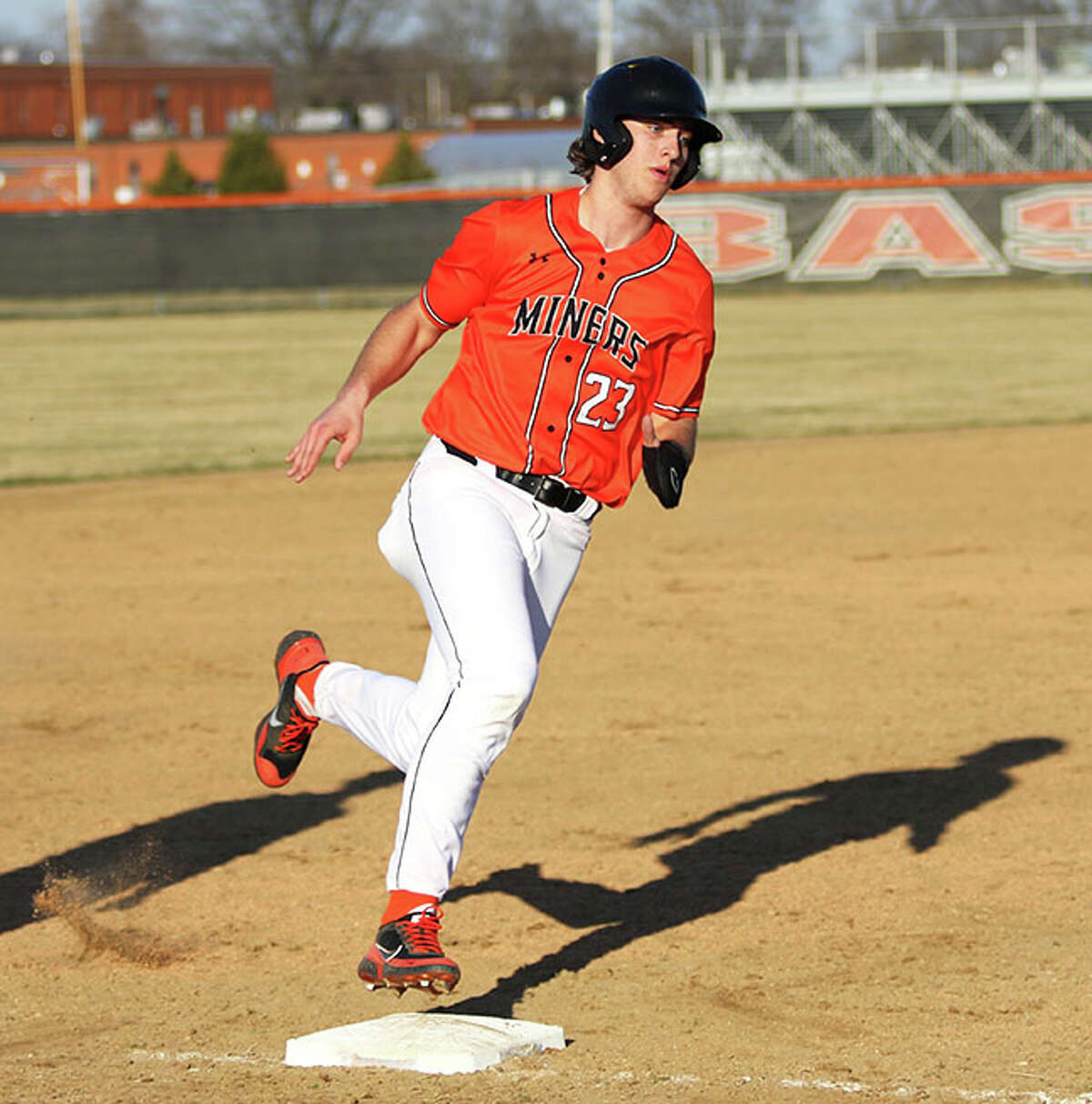 Gillespie's Kamryn Link, shown scoring a run in a game earlier this season in Gillespie, scored four runs in his four-hit day Monday in the Miners' win at Auburn.