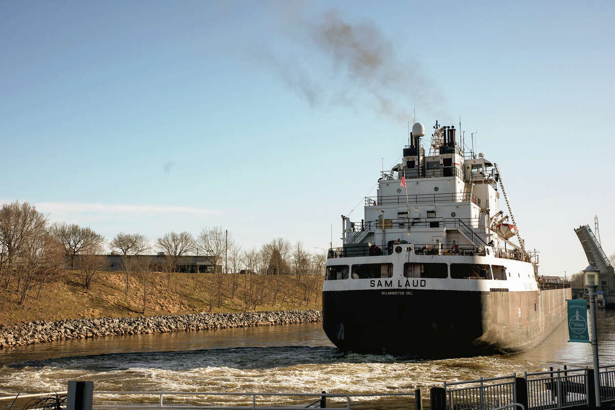 The first ship of the Great Lakes shipping season, the Sam Laud, wades through the Manistee River Channel on Tuesday morning. The ship had been delayed for 30 minutes because of an electrical issue with the U.S. 31 bascule bridge.