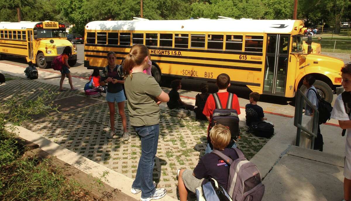 Buses line up at the end of the school day at Alamo Heights Junior School in this 2004 file photo.