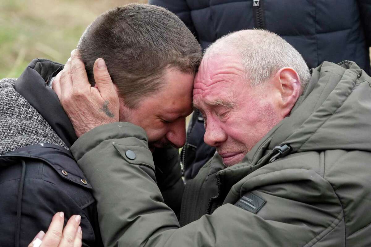Relatives cry at the mass grave of civilians killed during the Russian occupation in Bucha, Ukraine. Russia’s brutal invasion has pushed the world into a time of great uncertainty.