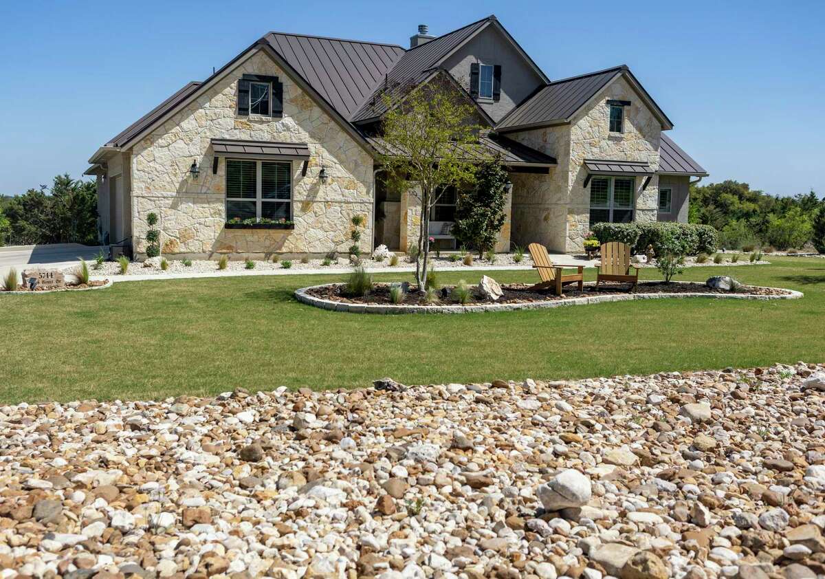 When Dan Mikiewicz and Kay Johnson bought their newly built home in the New Braunfels neighborhood of Copper Ridge there was little greenery. Today, as seen in this photo, the landscape overflows with everything from bicolor iris and Spanish lavender to Mexican feather grass, red oak, Gulf muhly grass and more.