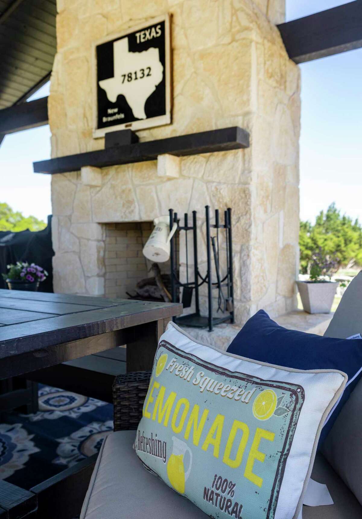 Dan Mikiewicz and Kay Johnson say their previous home in California was the party house. So they had a backyard pavilion complete with a fireplace built to bring that same atmosphere to Texas.