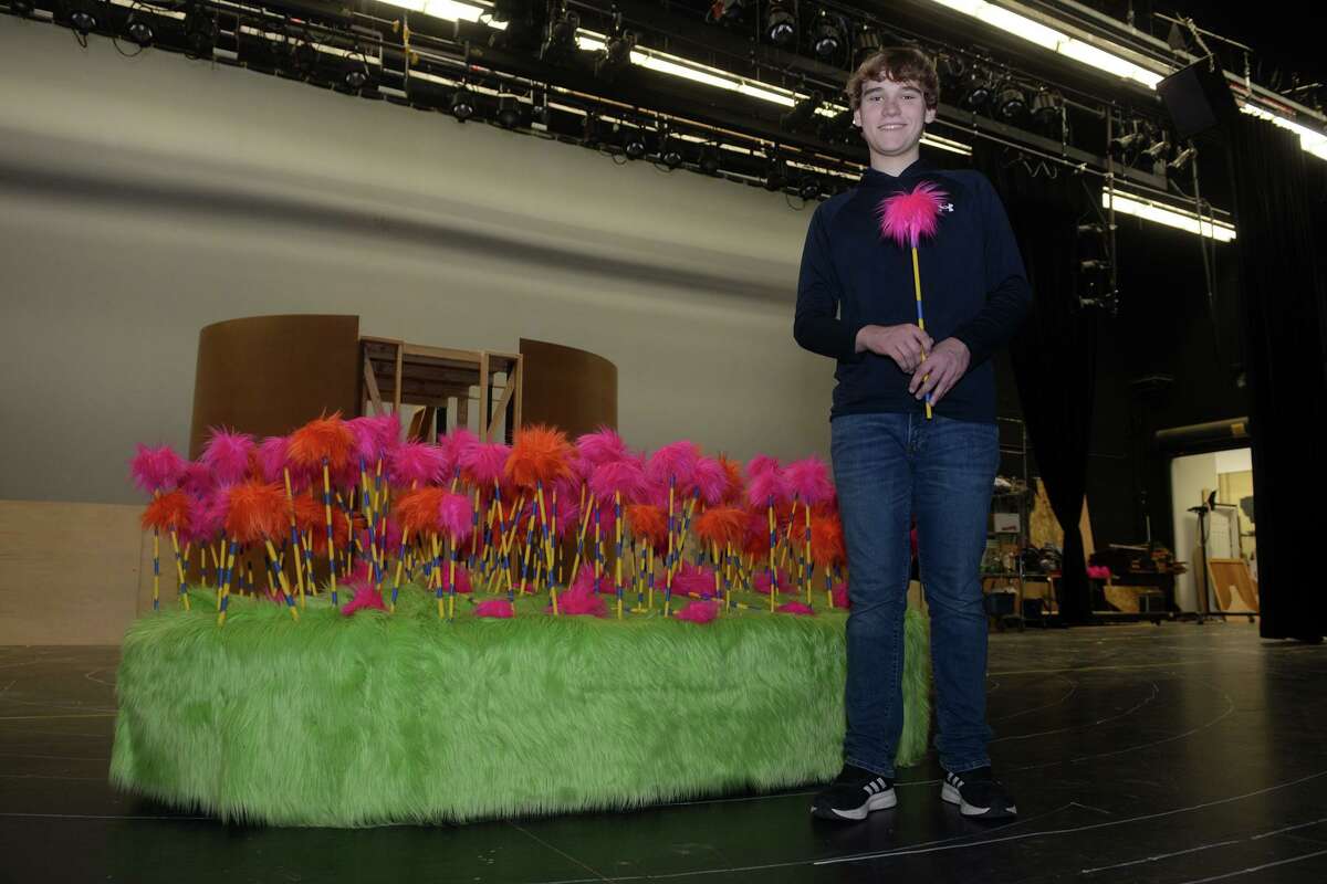 Freshman Ben Sousa poses on stage at Shelton High School, in Shelton, Conn. April 11, 2022. Sousa will plays the lead roll of Horton the Elephant in the upcoming production of “Seussical: The Musical.”