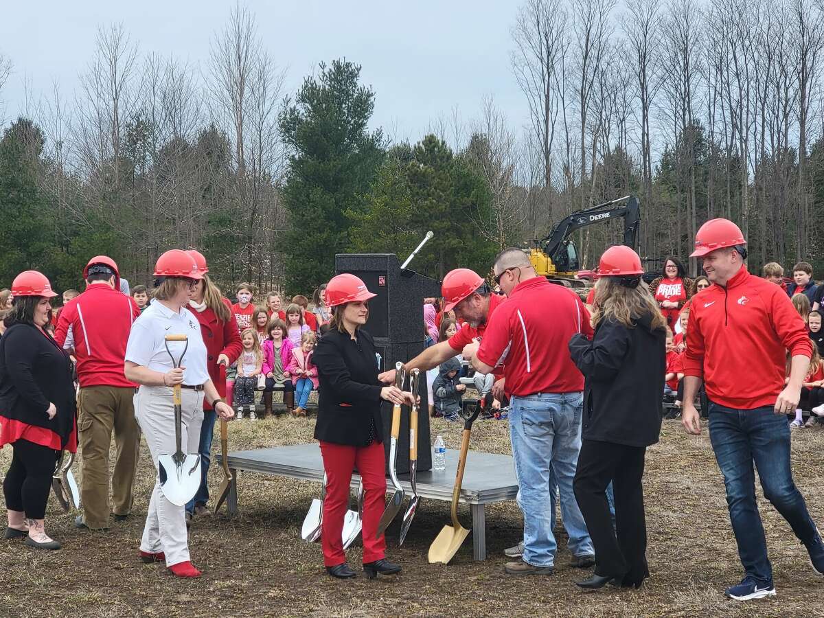 Benzie Central School Board of Education members and superintendent Amiee Erfourth get ready to dig in at the groundbreaking for Homstead Hills Elementary School in April.