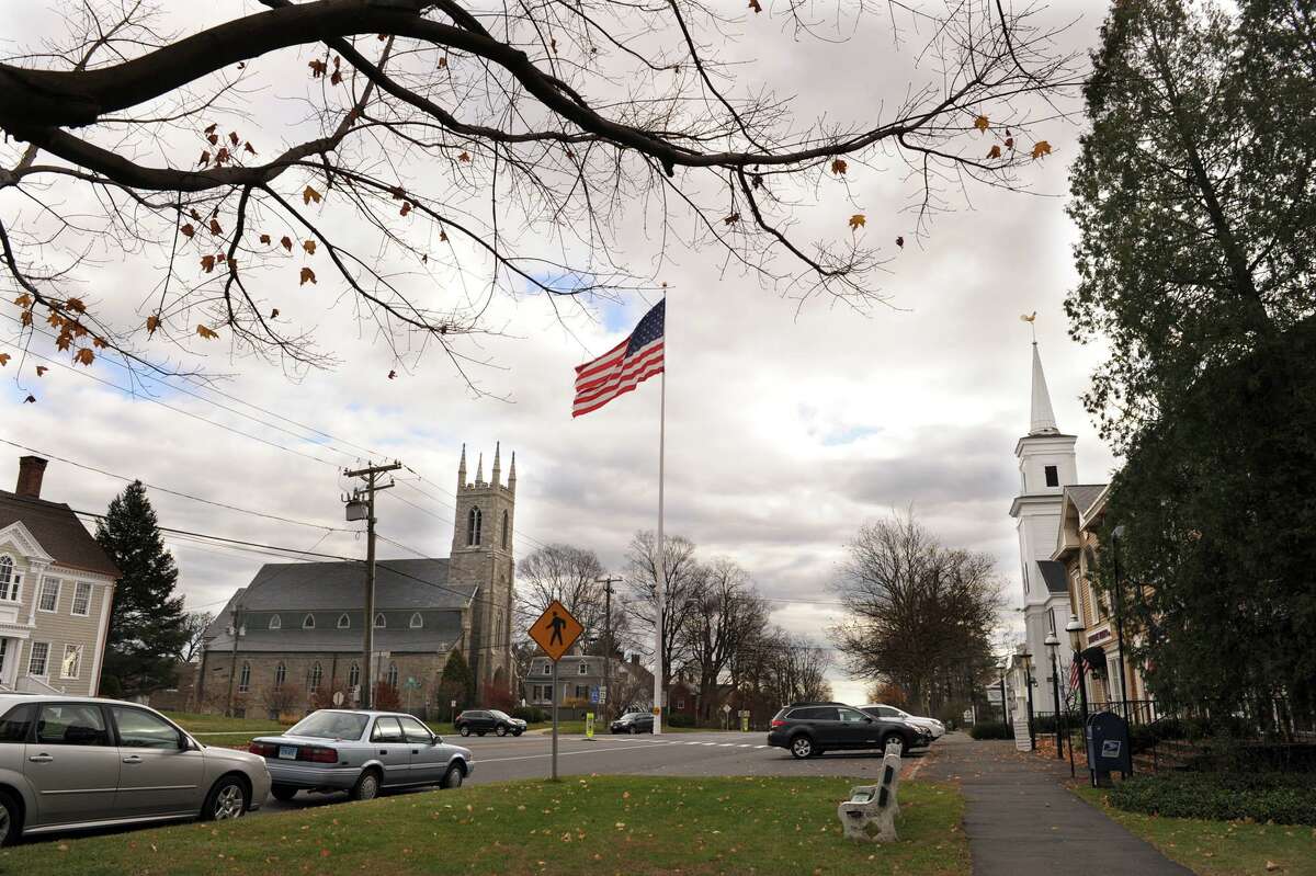 The Newtown flagpole sits in the center of town where Main and Church Streets meet.