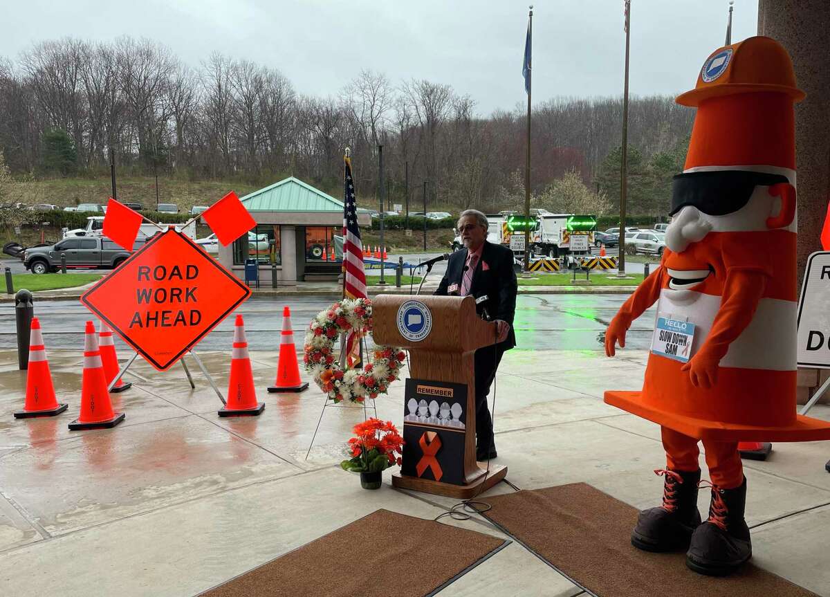 Connecticut Department of Transportation works to raise awareness of work zone safety during annual Work Zone Awareness Week. DOT Commissioner Joe Giuletti speaks alongside DOT mascot Slow Down Sam at DOT headquarters in Newington on Tuesday.