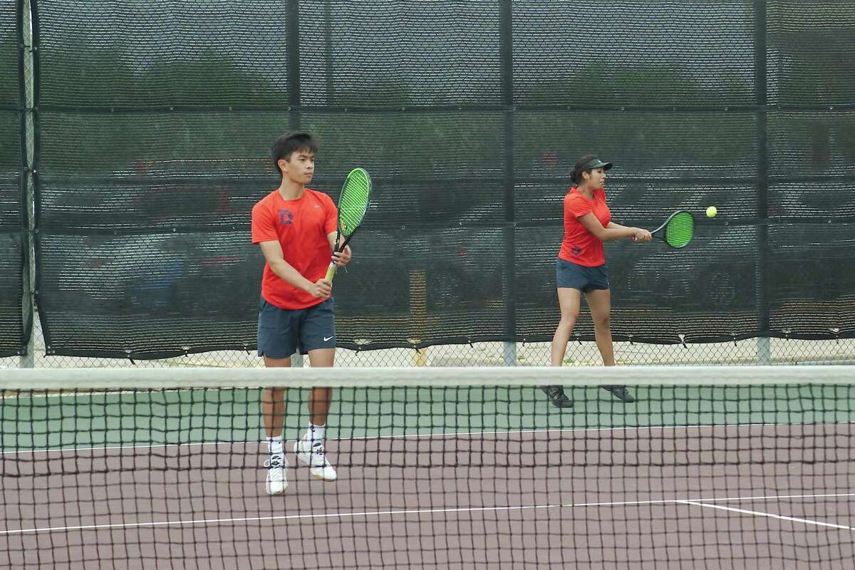 Dawson's Alex Hoang and Anya Chopra compete in a mixed doubles match against Stratford Tuesday at the Region 3-6A Tennis Tournament at Deer Park High School.