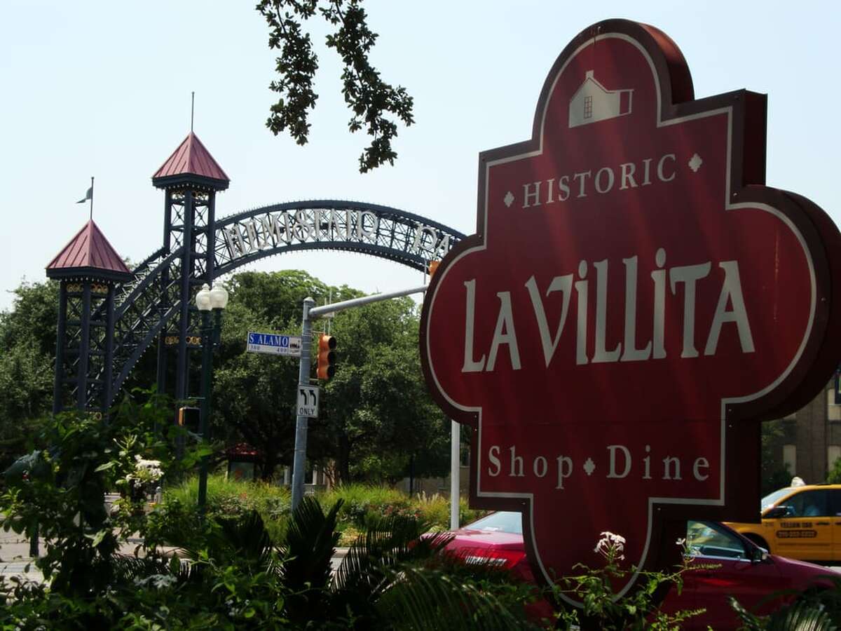 A sign welcoming visitors to the La Villita Historic Arts Village.