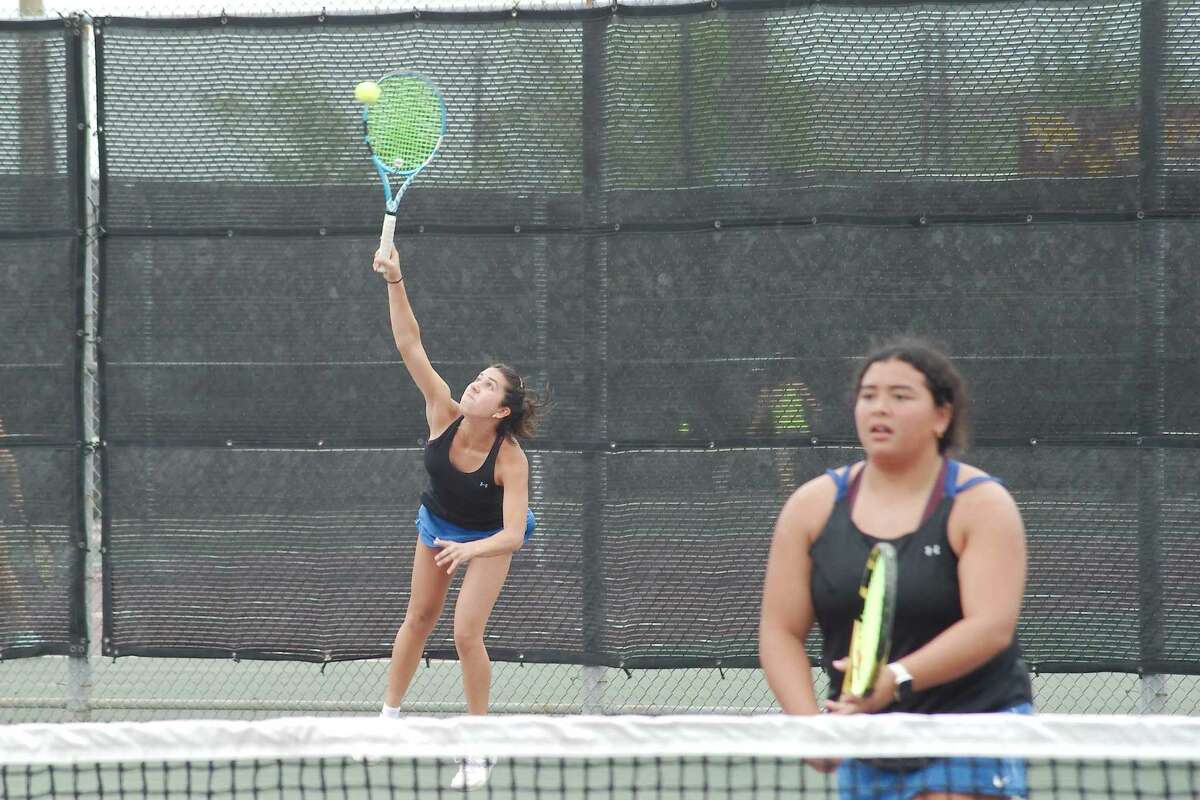 Clear Springs' Grace Labuga and Merlova Johnson compete in a girls doubles match against Deer Park Tuesday in the Region 3-6A Tennis Tournament at Deer Park High School.
