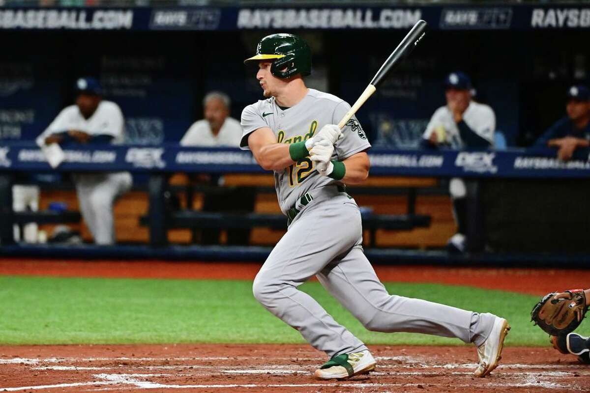 ST PETERSBURG, FLORIDA - APRIL 11: Sean Murphy #12 of the Oakland Athletics hits an RBI single in the fourth inning against the Tampa Bay Rays at Tropicana Field on April 11, 2022 in St Petersburg, Florida. (Photo by Julio Aguilar/Getty Images)