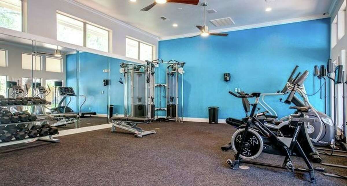 The property includes 150 one-, two-, and three-bedroom units averaging 955 square feet and a fitness center.