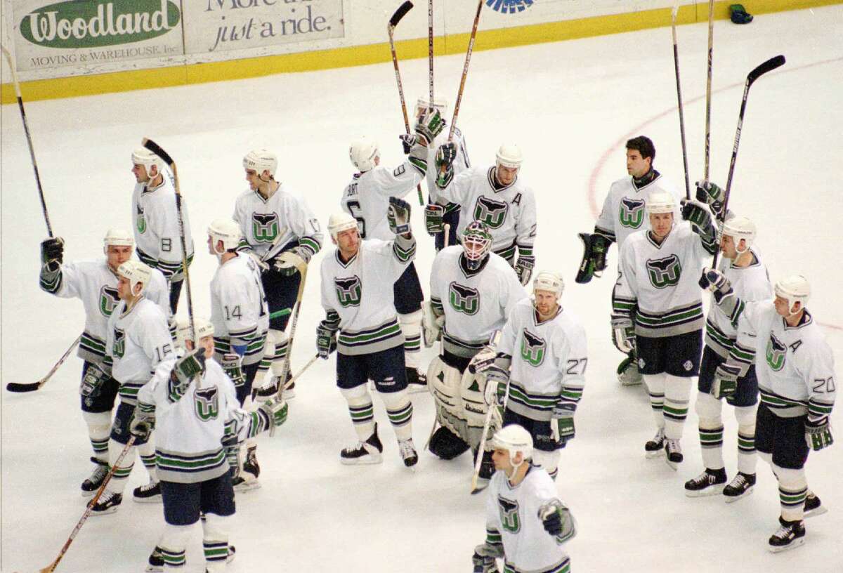 Members of the Hartford Whalers salute the fans after the team’s final game in 1997.