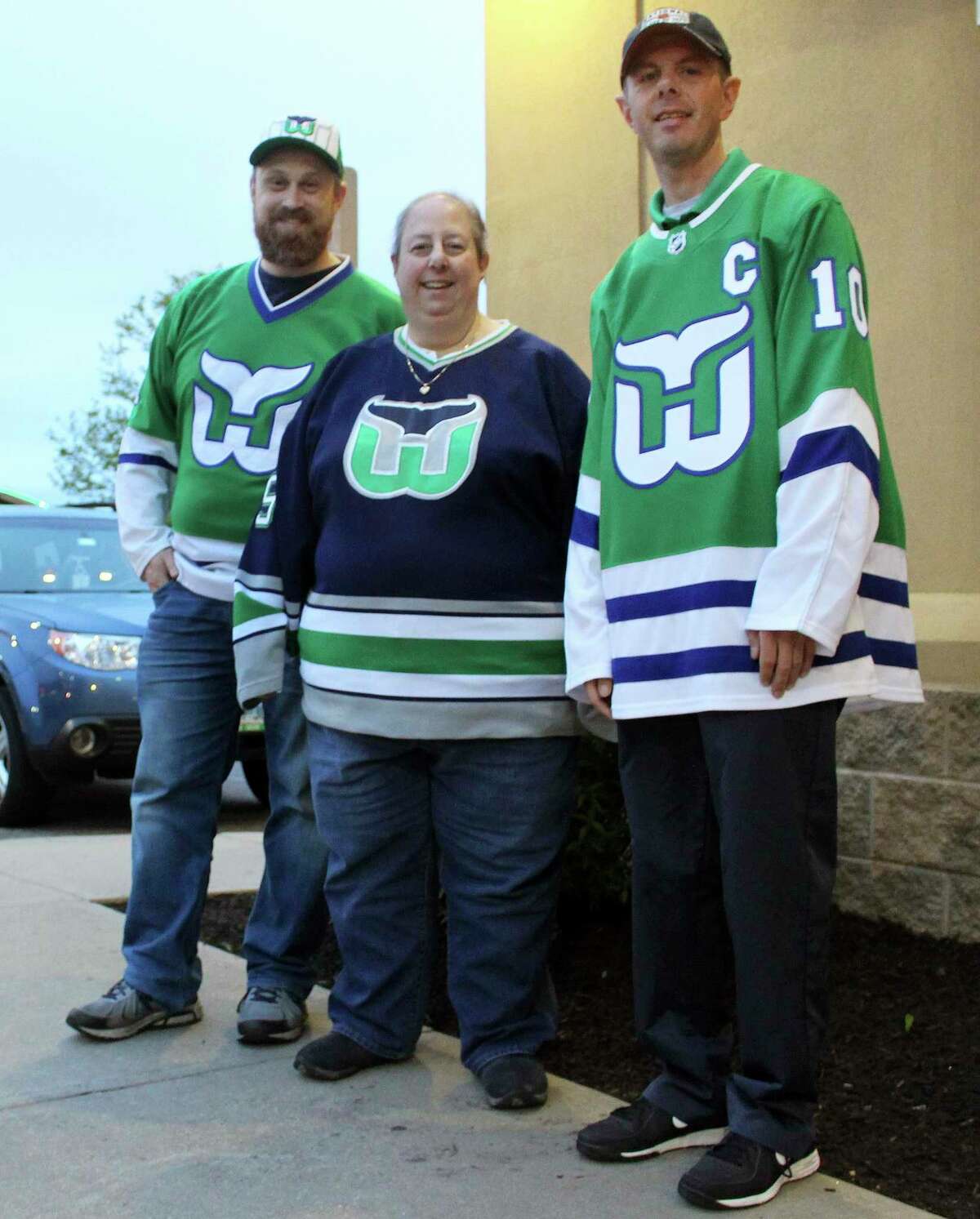 Hartford Whalers Booster Club members, from left, Scott St. Laurent, Joanne Coressa and Dan Narvesen pose outside a Manchester restaurant in 2019.