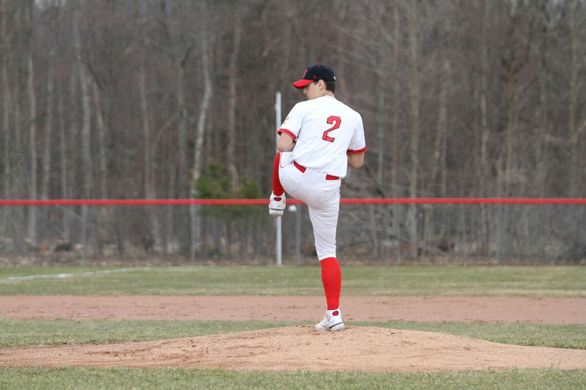 Junior pitcher Steve Barron winds up on the mound during Tuesday afternoon's game against Manton. 