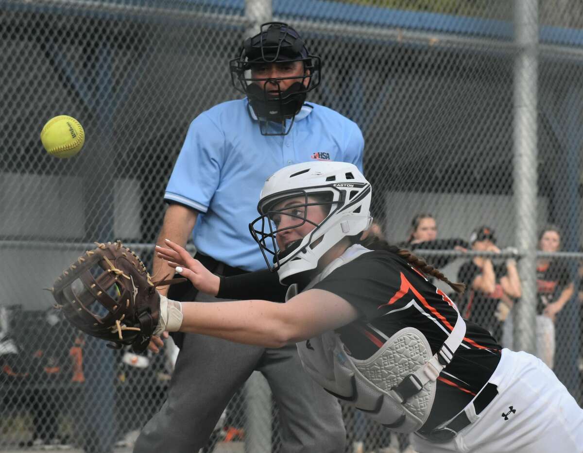 Edwardsville catcher Lexie Griffin makes a diving catch in the seventh against Belleville East in Southwestern Conference action on Tuesday in Belleville.