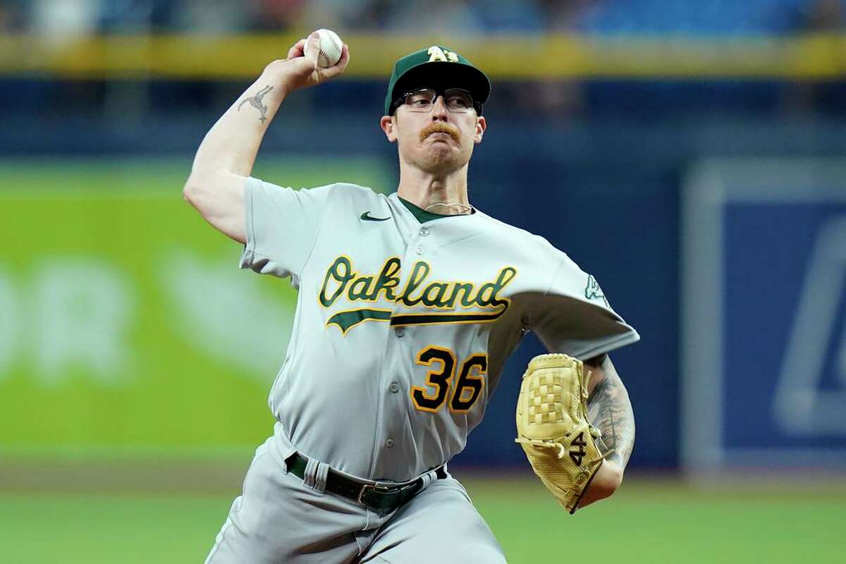 Oakland Athletics pitcher Adam Oller delivers to the Tampa Bay Rays during the first inning of a baseball game Tuesday, April 12, 2022, in St. Petersburg, Fla. (AP Photo/Chris O'Meara)