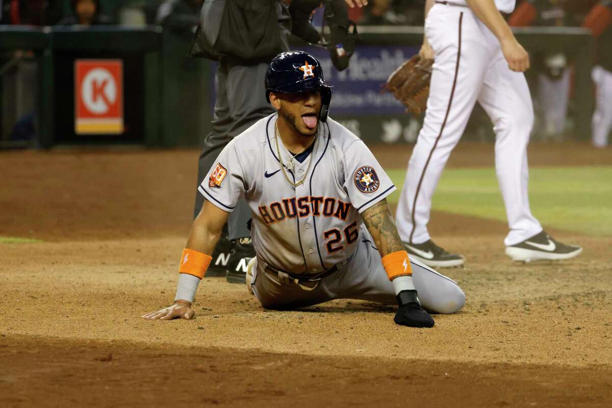Jose Siri of the Houston Astros reacts after scoring during the ninth inning against the Arizona Diamondbacks at Chase Field on April 12, 2022 in Phoenix, Arizona.