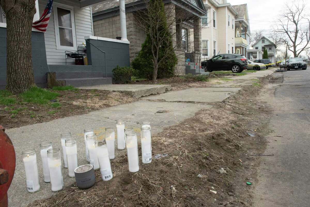 A memorial is set up near 967 Maple Ave. where Dwayne L. Harris, 21, was found mortally wounded inside on Wednesday, April 13, 2022 in Schenectady, N.Y.